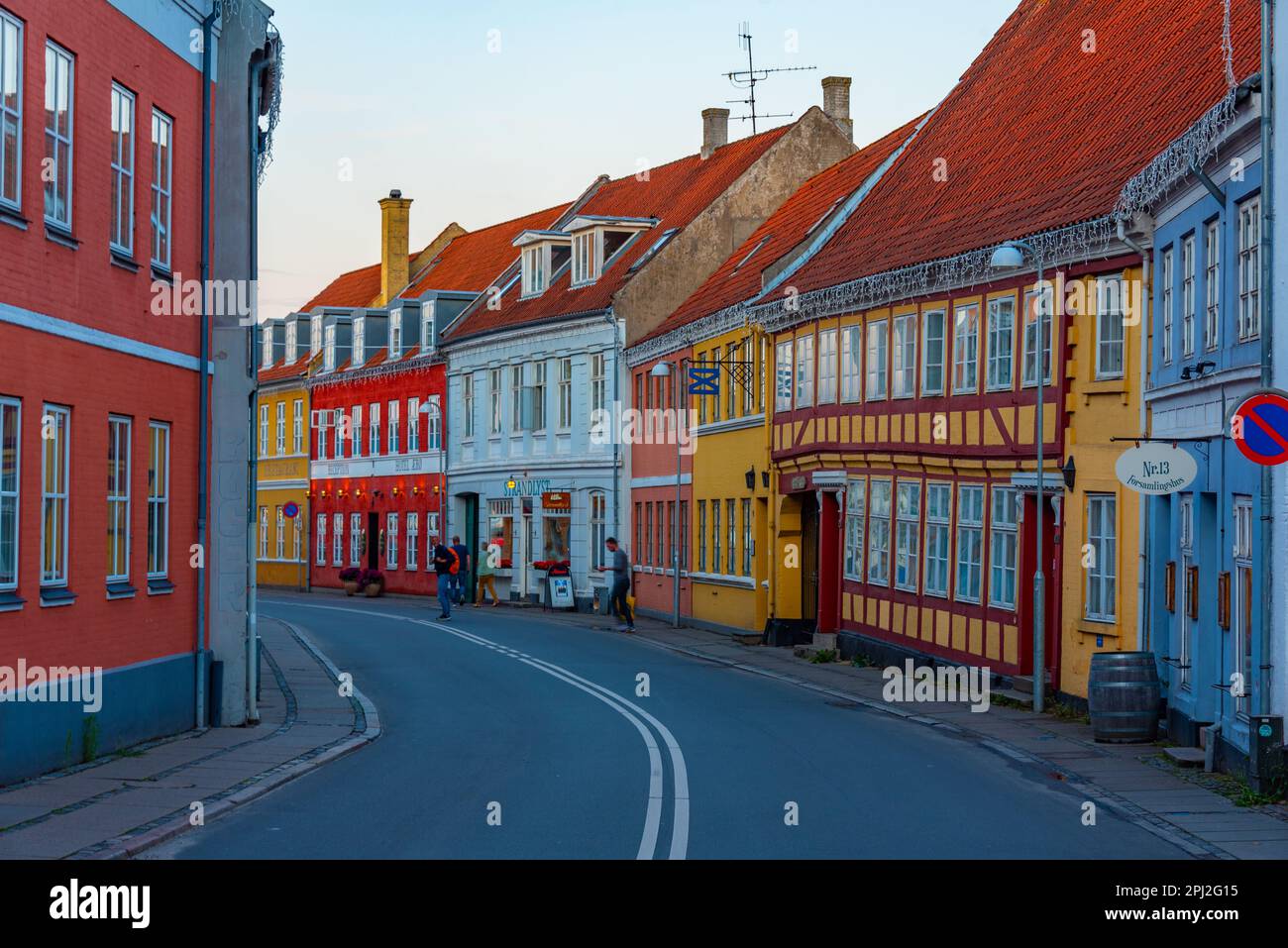Svendborg, Denmark, June 20, 2022: Sunset view of a street in center of Svendborg, Denmark. Stock Photo