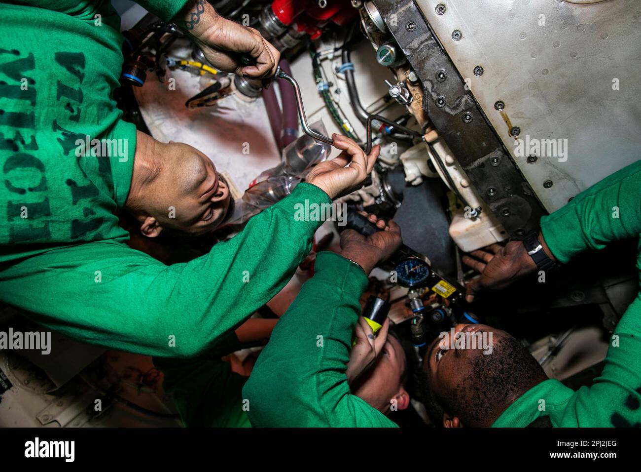 Adriatic Sea. 25th Feb, 2023. Aviation Machinists Mate Airman Kendal Cook, left, Aviation Machinists Mate 3rd Class James Barclift, right, and Aviation Machinists Mate 1st Class David Carlile, all assigned to Strike Fighter Squadron (VFA) 143, perform maintenance on an air turbine starter aboard the Nimitz-class aircraft carrier USS George H.W. Bush (CVN 77) Credit: U.S. Navy/ZUMA Press Wire Service/ZUMAPRESS.com/Alamy Live News Stock Photo