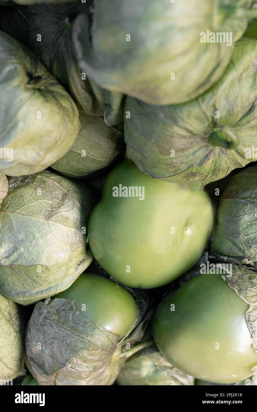 Close up of some green tomatoes in a street market stall Stock Photo ...