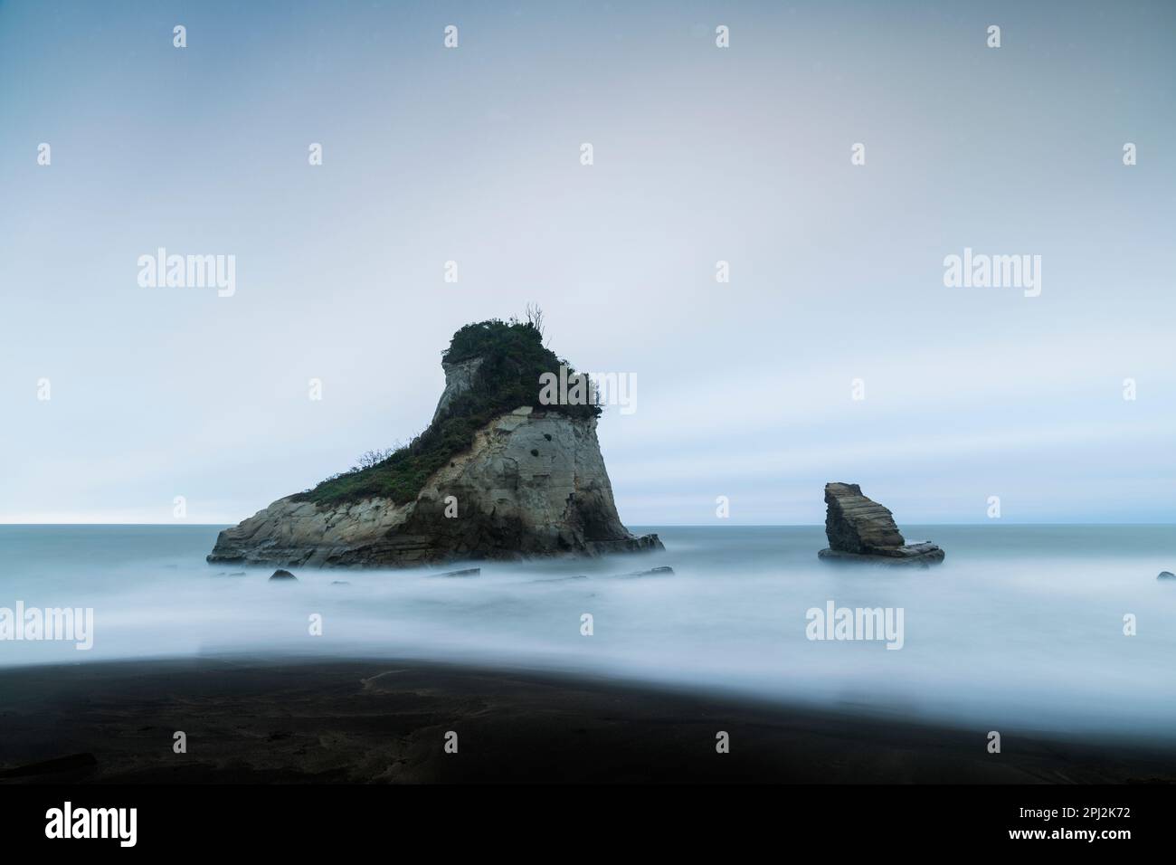 Long exposure shot of sea stacks in the water, Chiba Prefecture, Japan Stock Photo