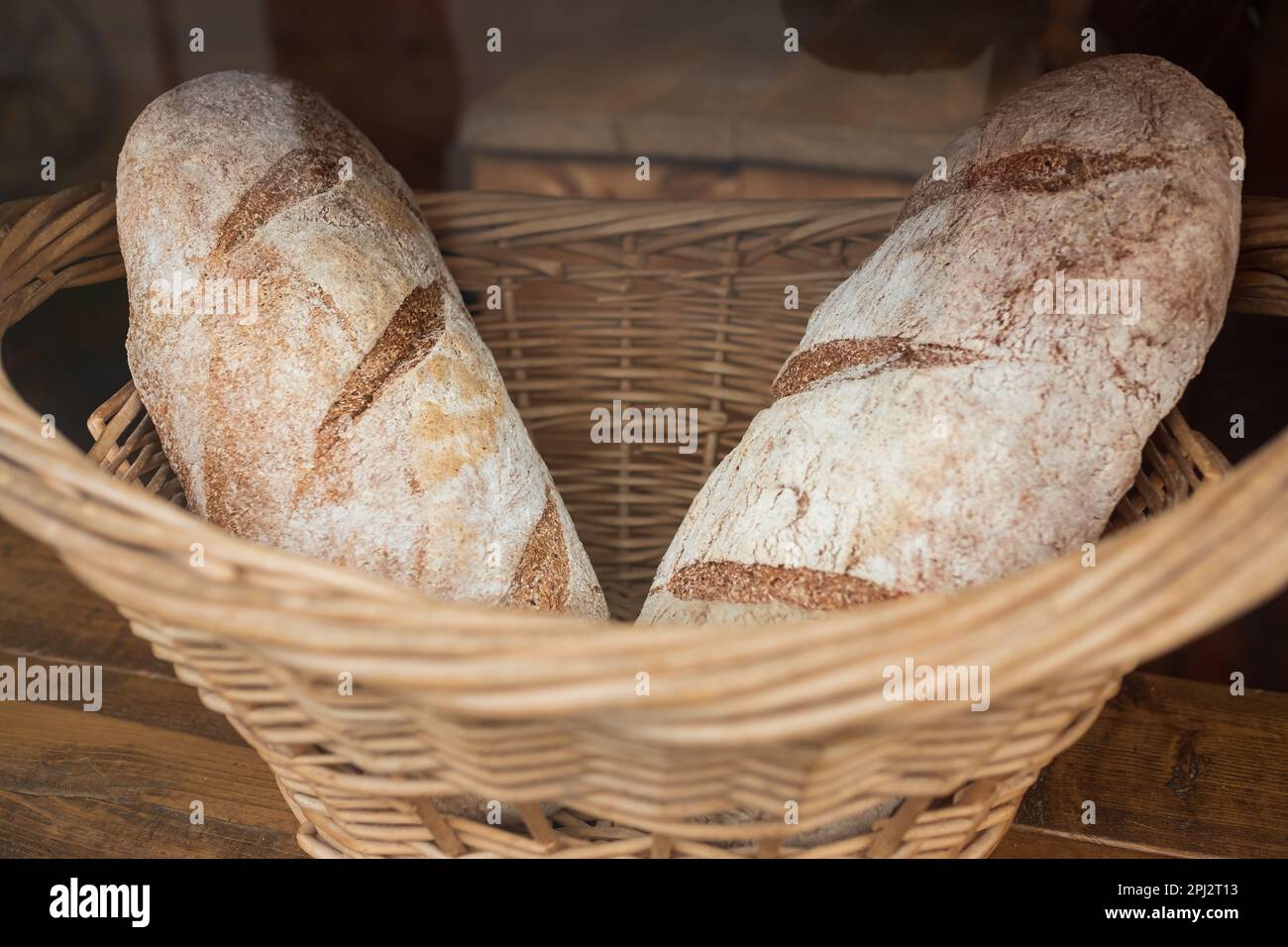 Homemade bread, small bakery, natural farm products, domestic production. Healthy and tasty organic food. Basket with various bread freshly baked. Tra Stock Photo