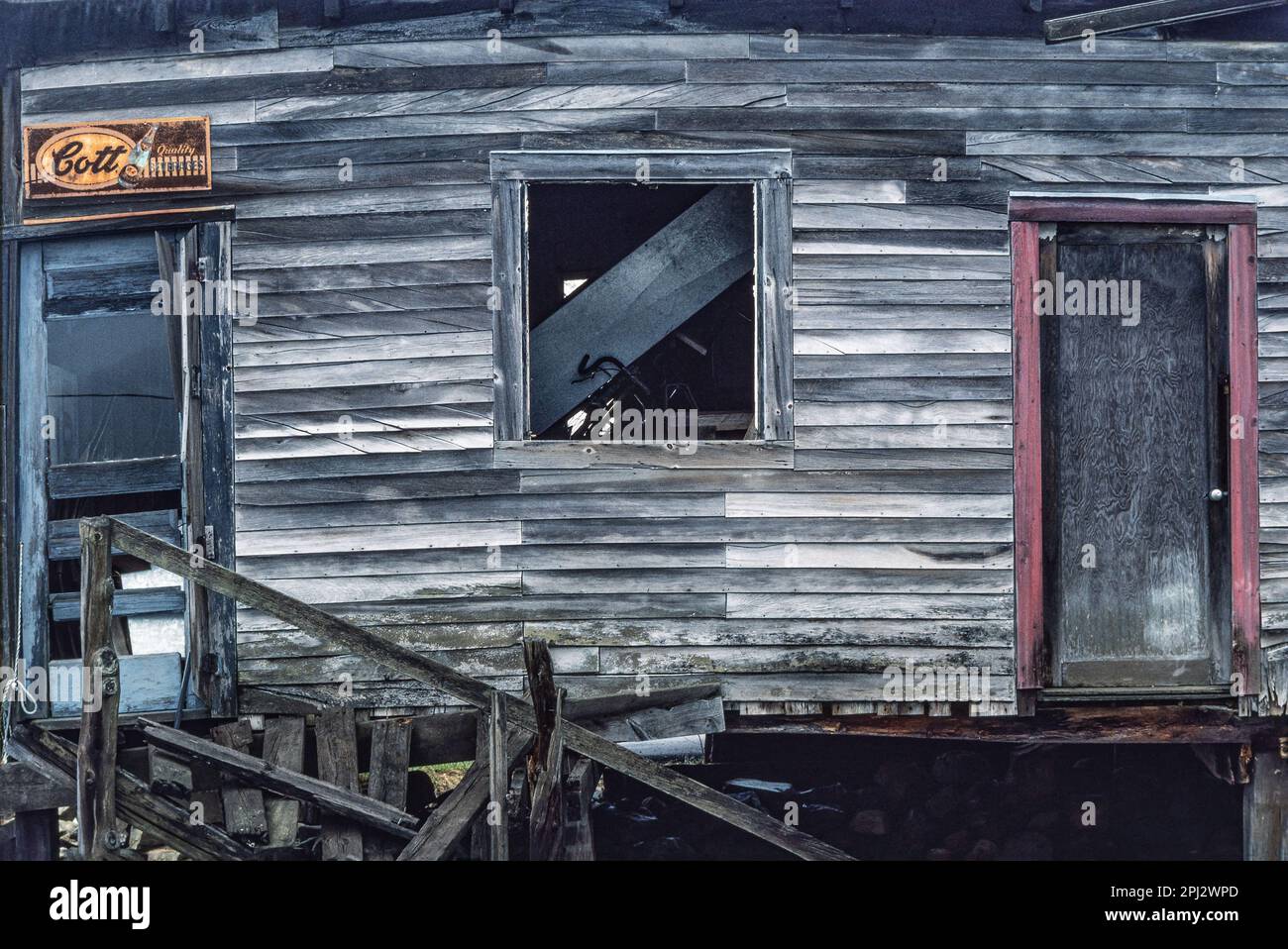 Old lobster shacks with hand painted graphics and weathered clapboard on wharf at York Harbor