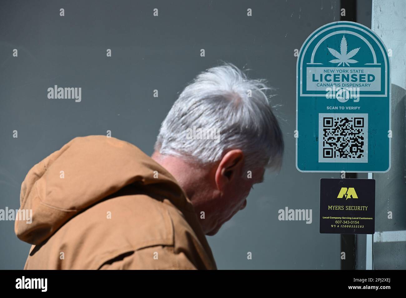 New York, USA. 30th Mar, 2023. A man waits in line outside for the