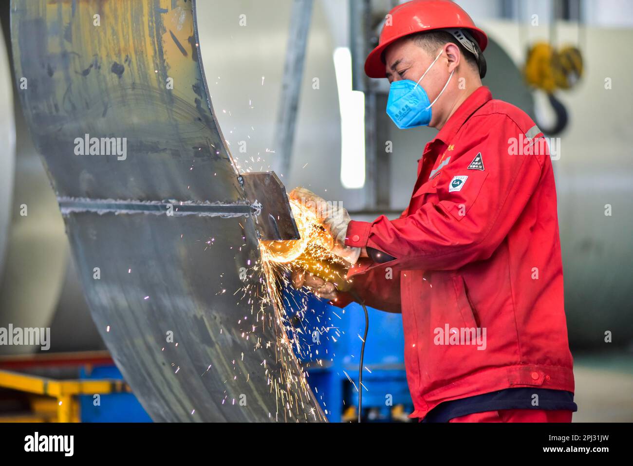 QINGZHOU, CHINA - MARCH 31, 2023 - A worker welds at a workshop of a ...