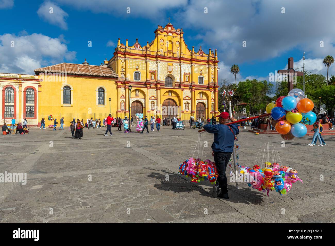 Balloon seller in San Cristobal de las Casas and Cathedral, Chiapas, Mexico. Stock Photo