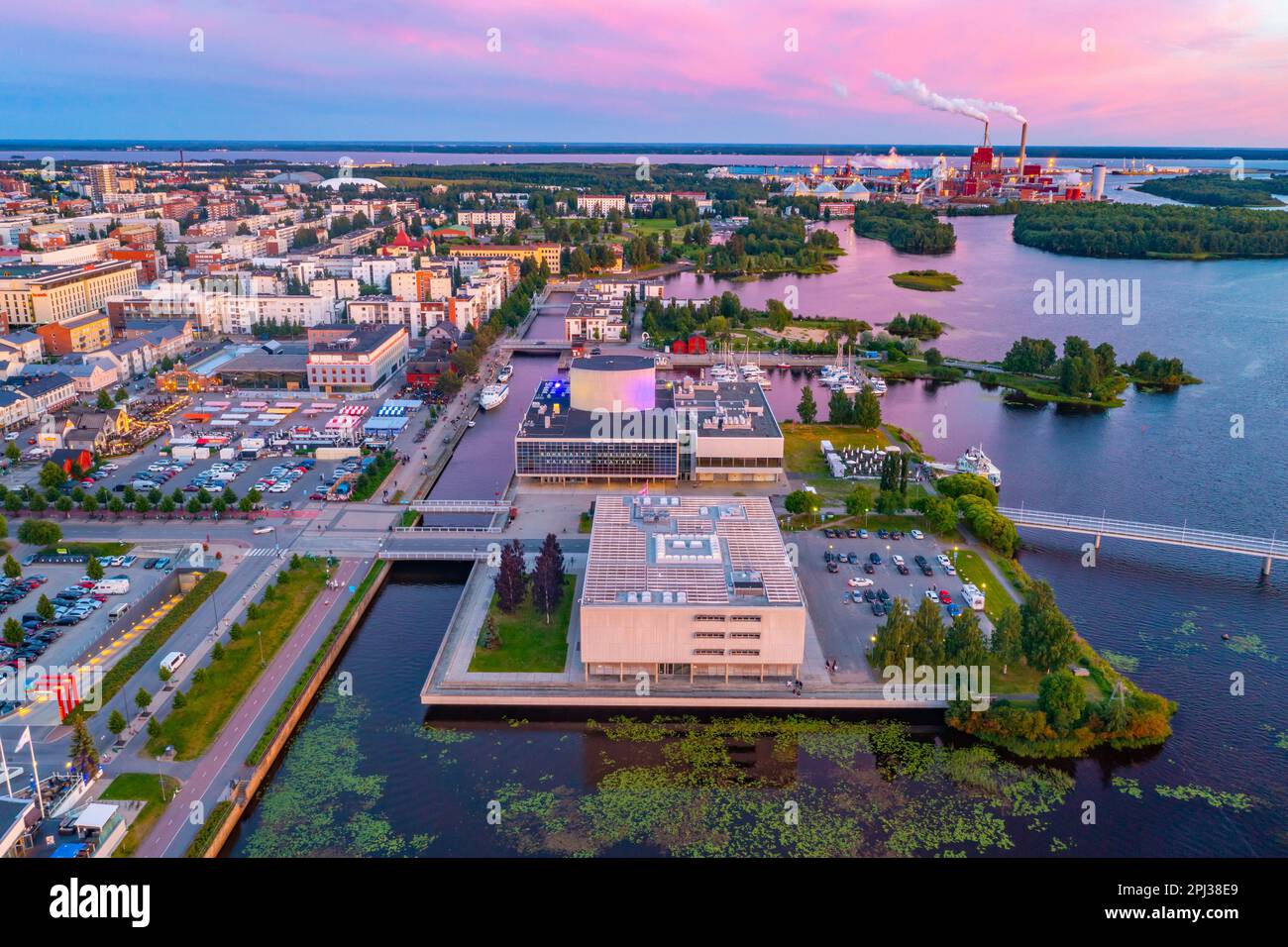 Oulu, Finland, July 22, 2022: Sunset aerial view of Oulu theatre and industrial park in Finland. Stock Photo