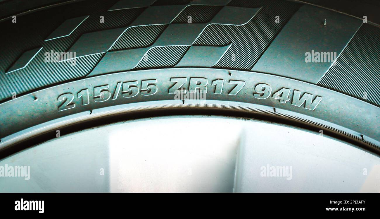 Numbers and characters on the sidewall of a car tire, automotive parts concept. Stock Photo