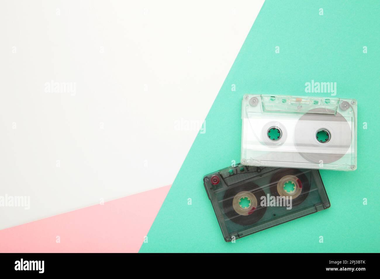 Old cassettes on a colorful background. Music day, top view Stock Photo