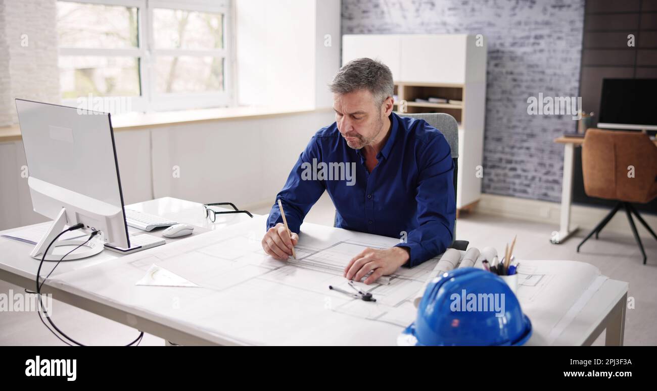 Architect Engineer Drawing Architectural Construction Plan In Office Stock Photo