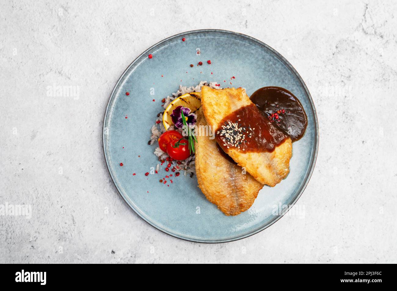 Fried tilapia fish with rice sauce and vegetable Stock Photo Alamy