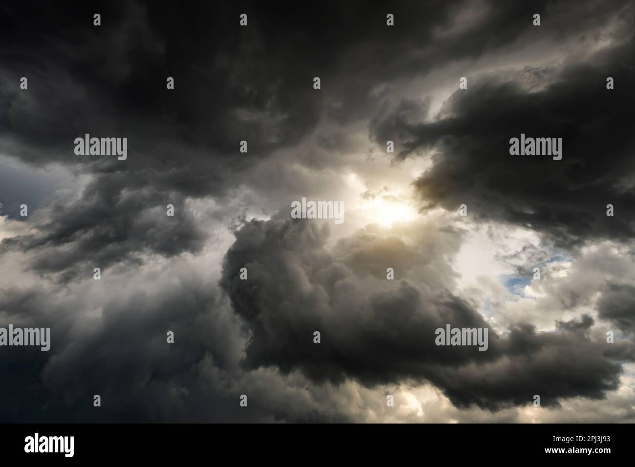 Stormy Rain Clouds Background with a Light Stock Photo - Alamy