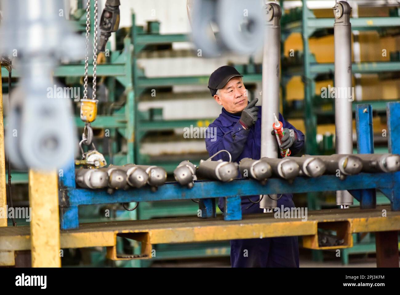 QINGZHOU, CHINA - MARCH 27, 2023 - A worker works in a workshop of a ...