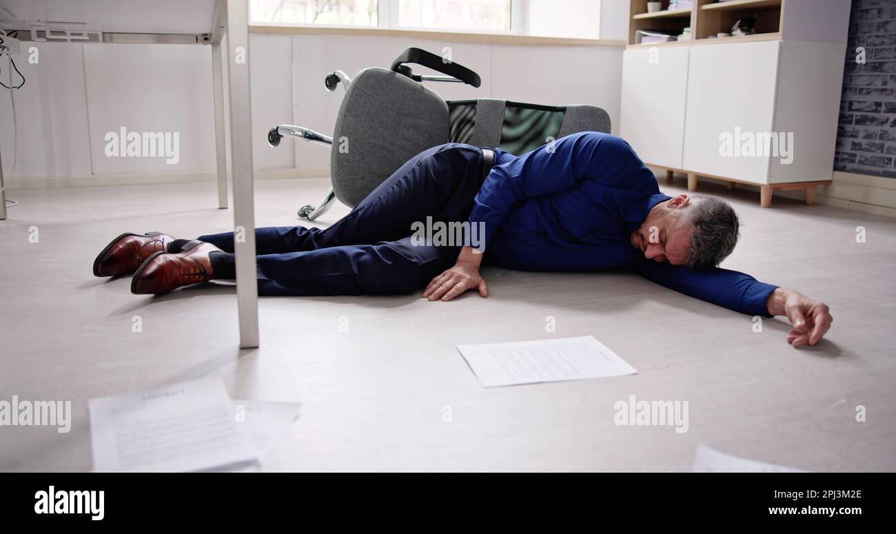Faint Accident In Office. Fall From Chair At Workplace Stock Photo Alamy