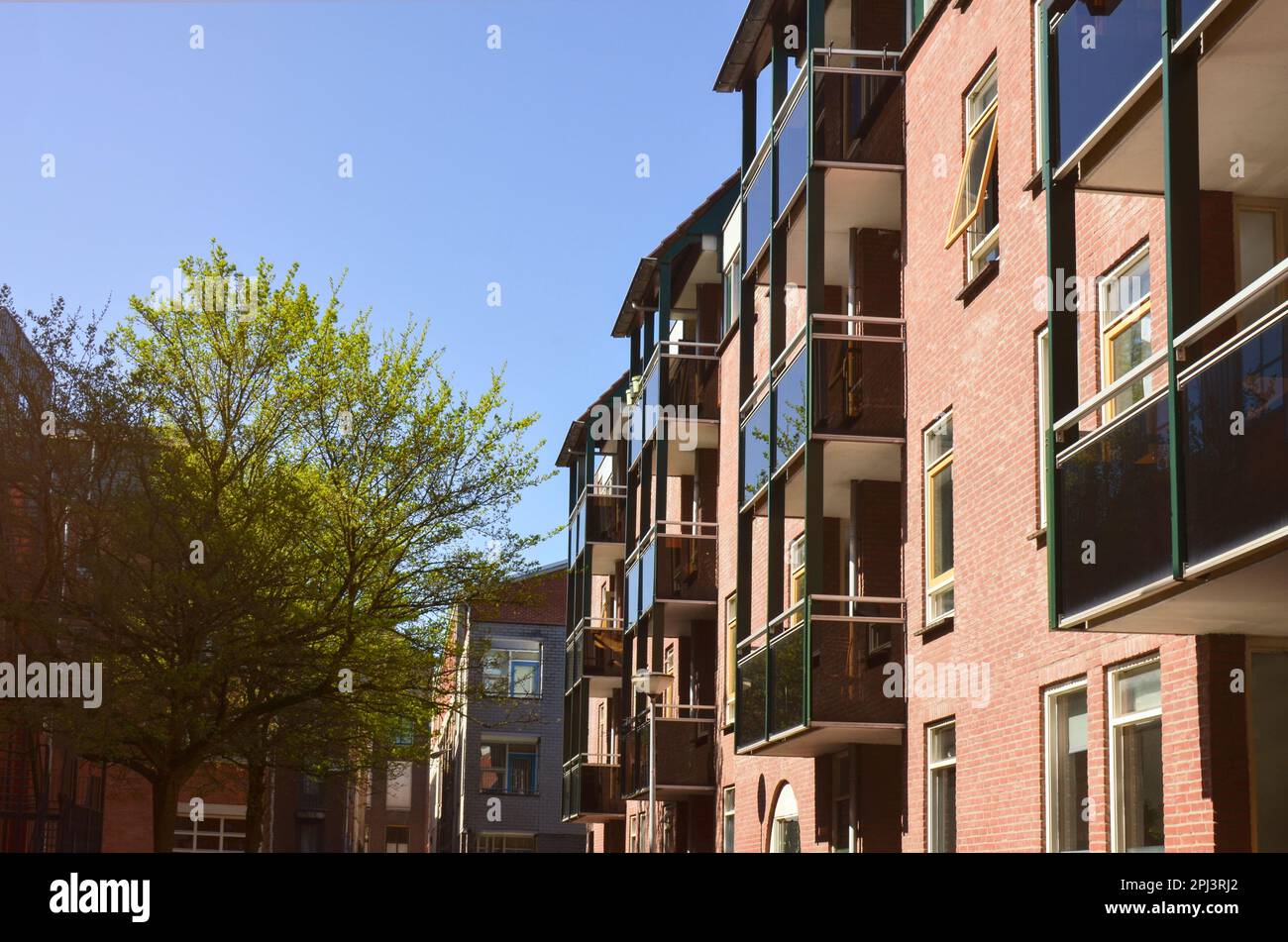 Beautiful view of modern house with balconies on city street Stock ...