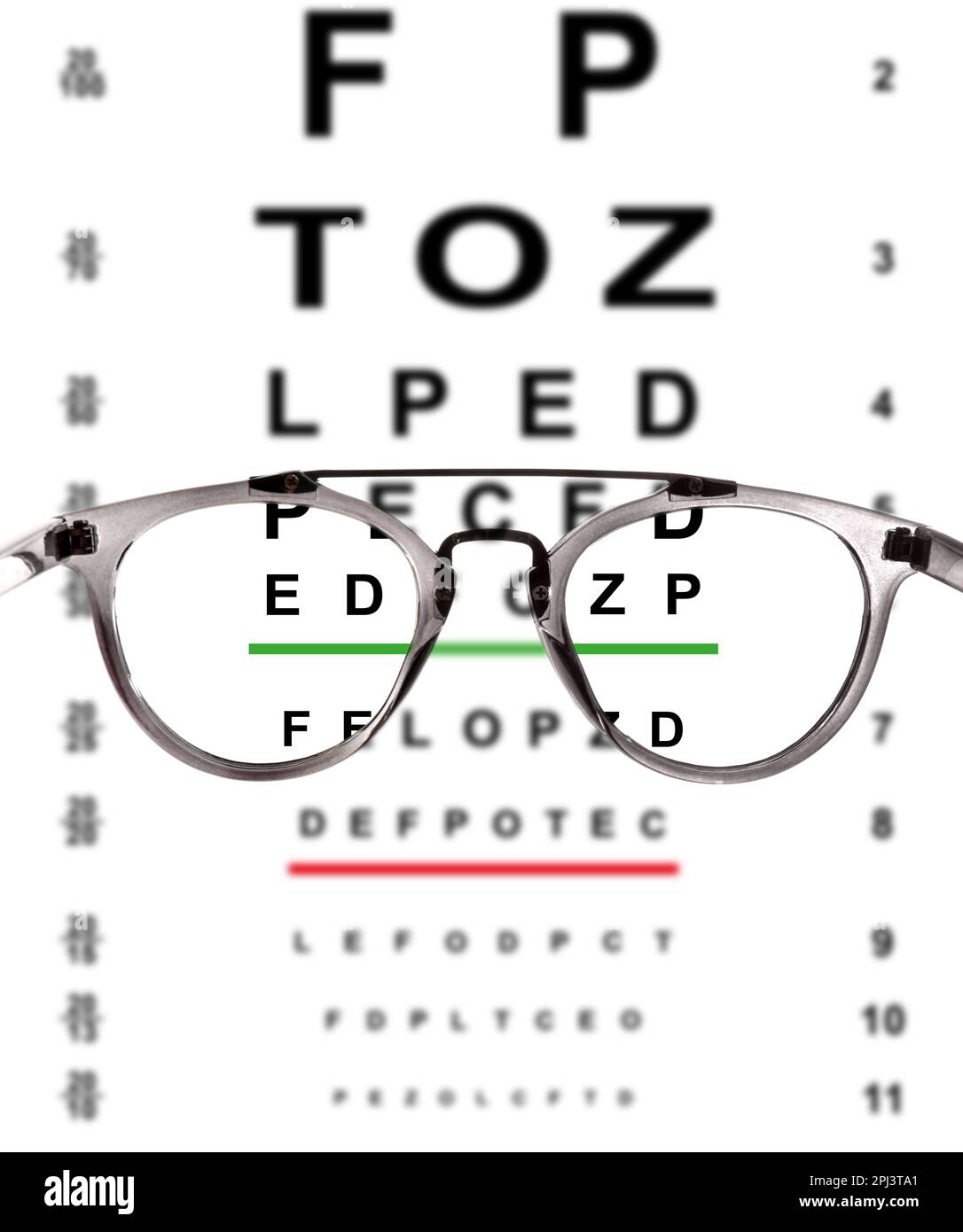 View through glasses on eye chart, white background Stock Photo - Alamy