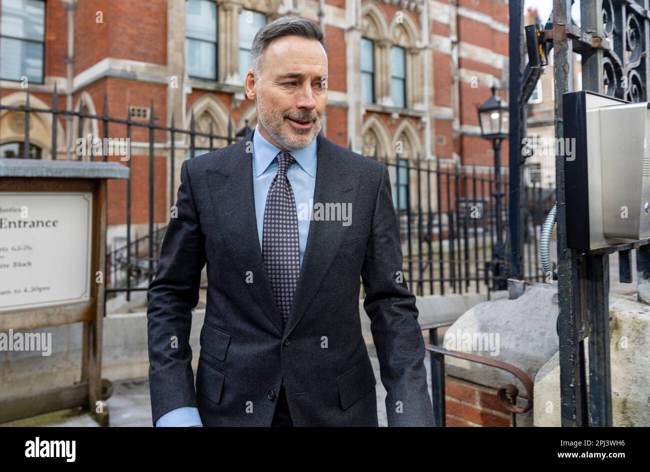 pic shows: David Furnish the husband of Elton John  leaves the High Court in London 30.3.23  He fist bumped the security guard from the court that had Stock Photo