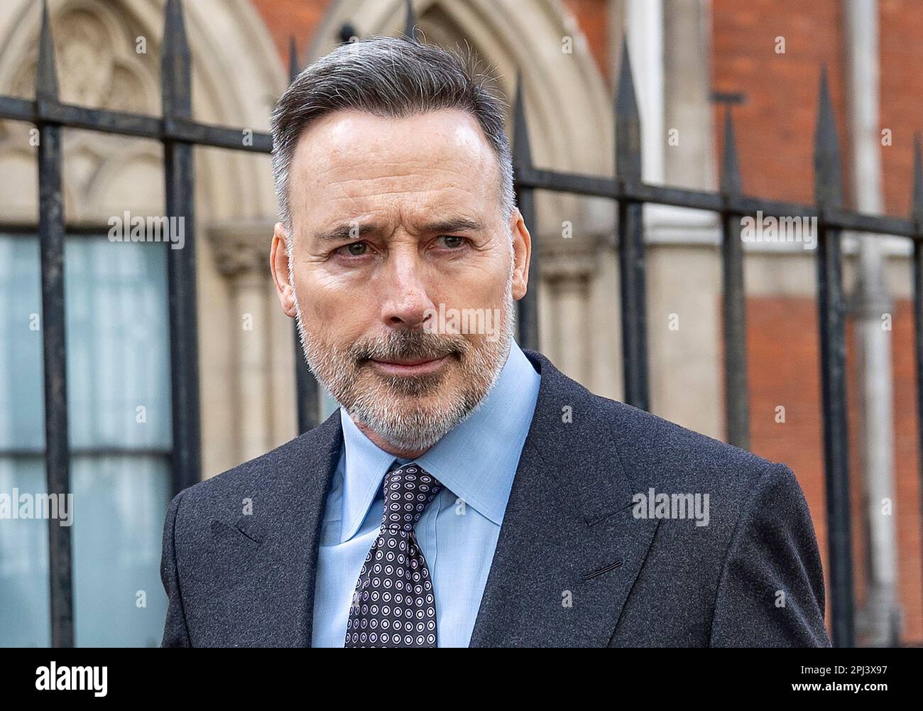 pic shows: David Furnish the husband of Elton John  leaves the High Court in London 30.3.23   He fist bumped the security guard from the court that ha Stock Photo