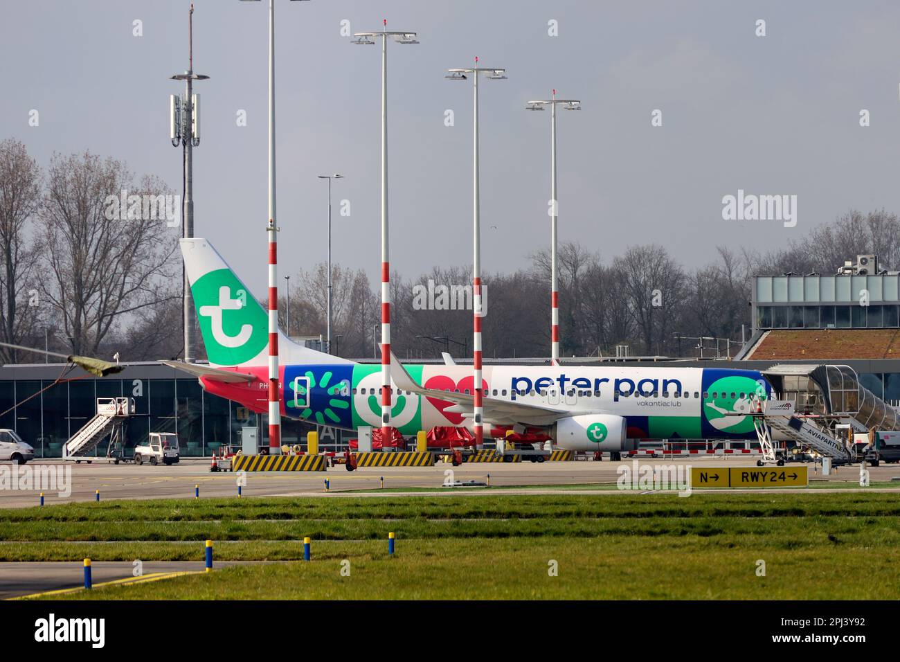 Transavia plane with Peter Pan flying club advertisement at Rotterdam The Hague Airport. The Peter Pan flying club organizes trips for young people wh Stock Photo