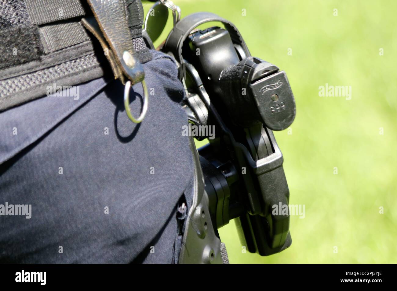 Walther p99 gun on the belt of an agent of the Dutch police in the Netherlands Stock Photo