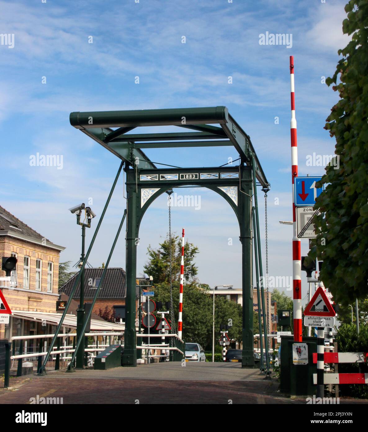 Òld steel drawbridge over river Hollandse IJssel in the city of Haastrecht in the Netherlands. Stock Photo