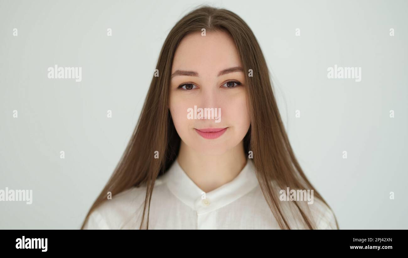 Portrait of young caucasian woman with long hair on white background ...