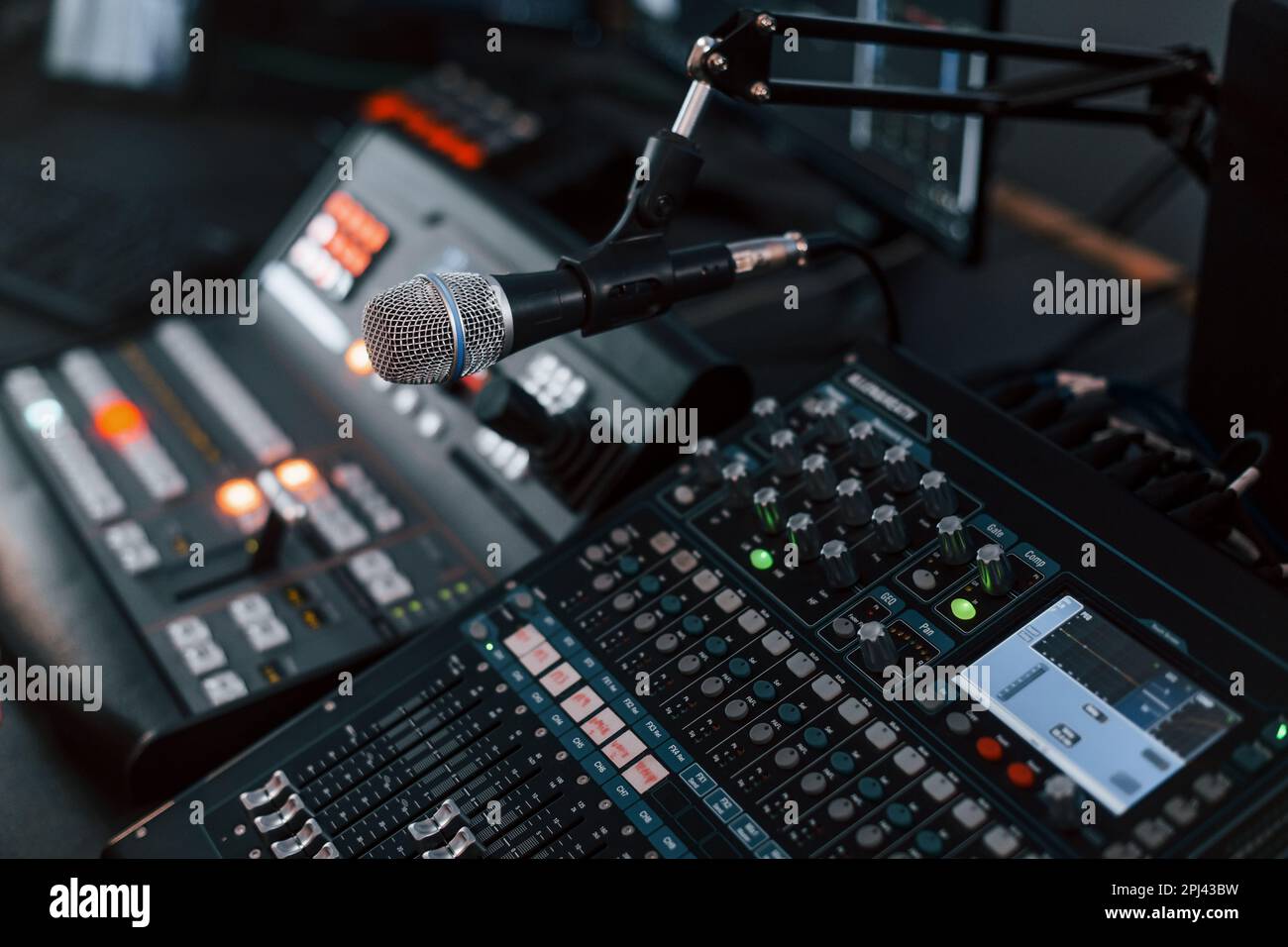 Close up view of radio mixing desk with professional sound equipment