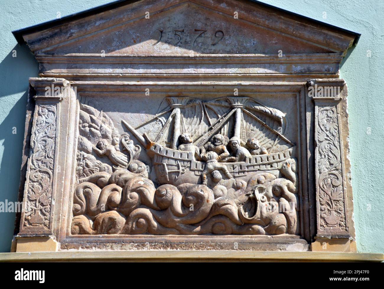 Germany, Saxony, Pirna:  mediaeval stone relief (1579) showing the Bible scene of Jonah being thrown overboard. Stock Photo