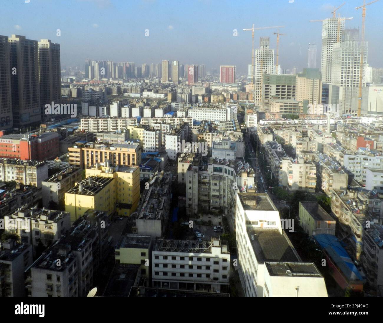 People's Republic of China, Yunnan Province, Kunming:  view of the city from the revolving restaurant of the Jin Jiang Hotel, with Beijing Road (right Stock Photo