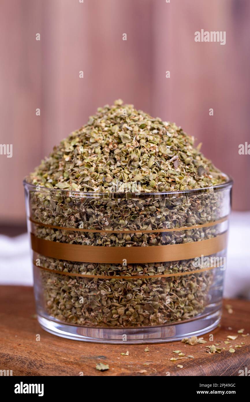 Thyme spice. Dried Thyme leaf in glass bowl on wood floor. Spice