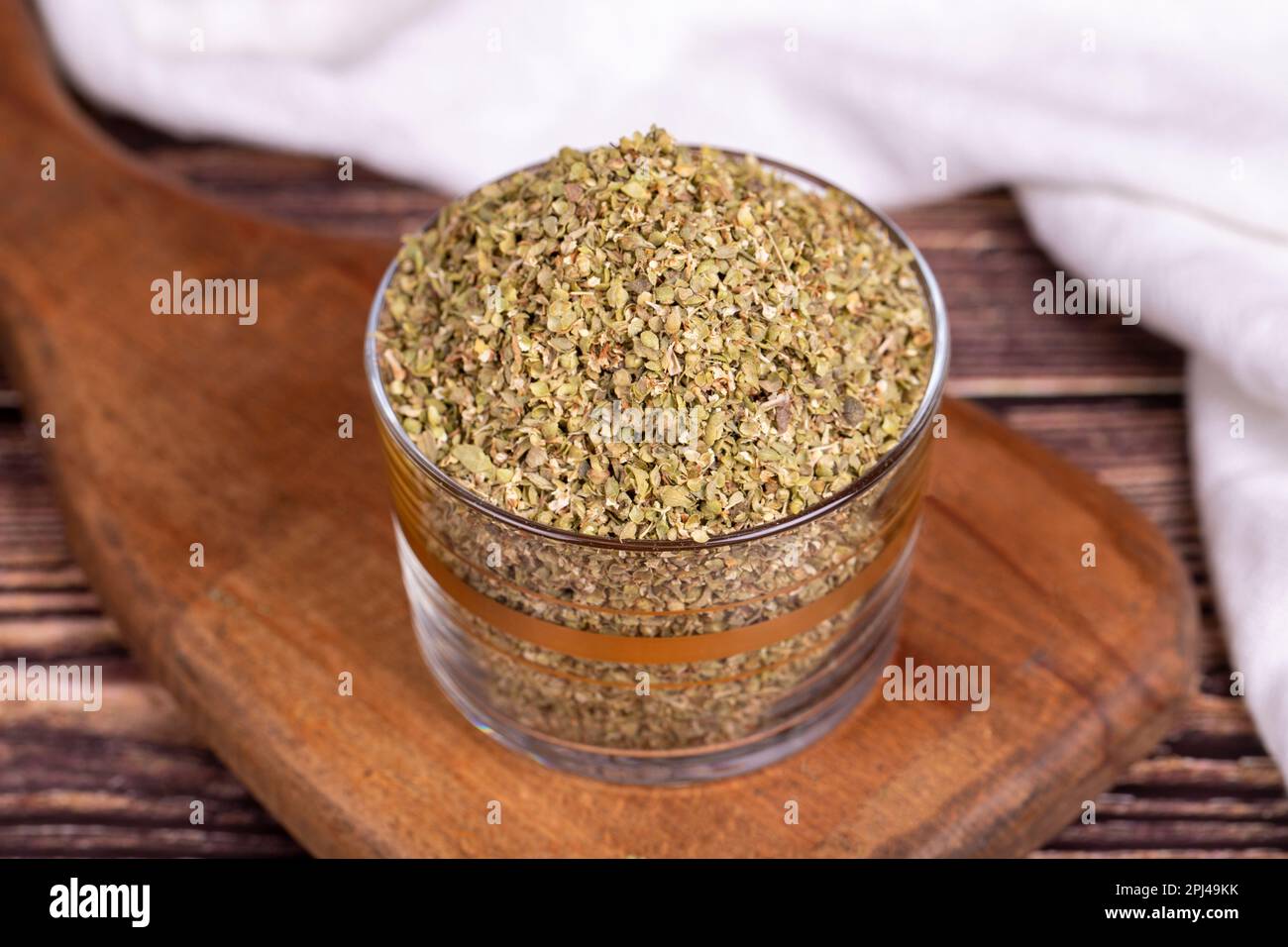 Thyme spice. Dried Thyme leaf in glass bowl on wood floor. Spice