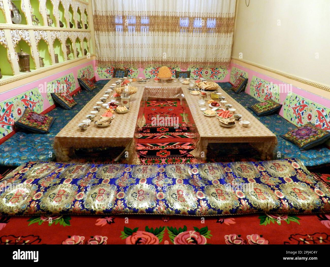 People's Republic of China, Xinjiang Province, Kashgar:    private banqueting room awaiting guests in a city-centre restaurant. Stock Photo