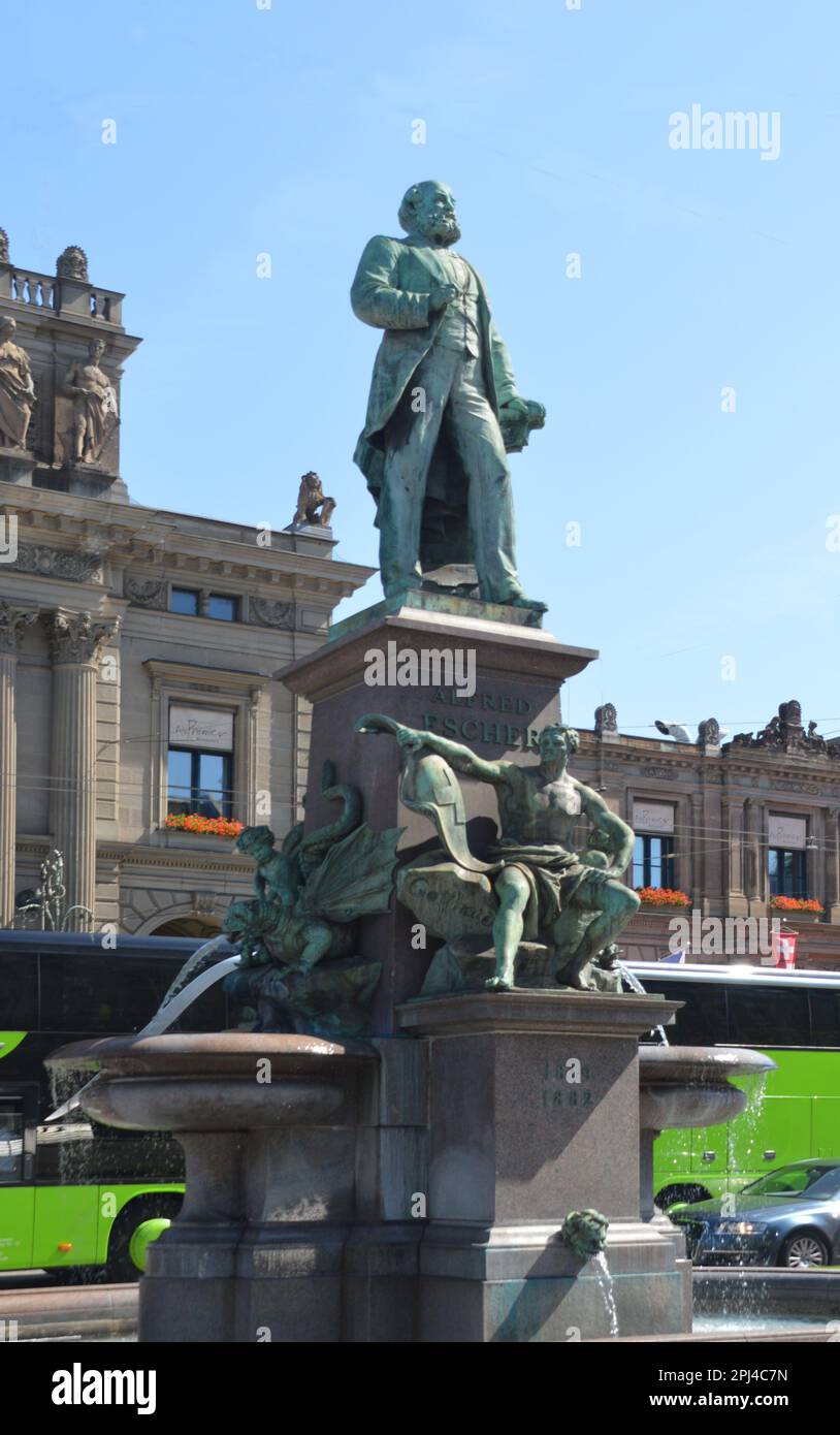 Switzerland, Zurich:  monument to Alfred Escher, Swiss politician, business leader and railway pioneer standing in front of the railway station. Stock Photo