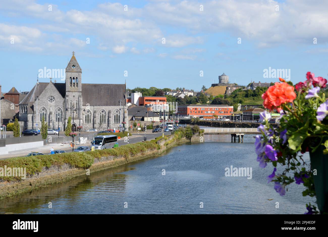 Ireland, Louth, Drogheda:  view from the roadbridge over the River Boyne, with St. Peter's Roman Catholic Church on the left and a Martello tower on t Stock Photo