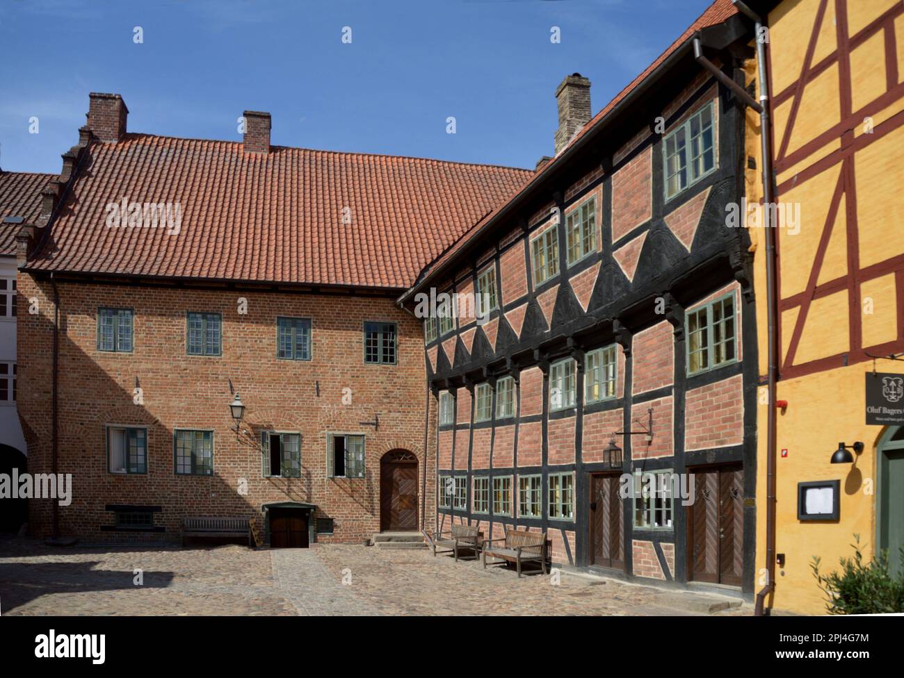 Denmark, Odense:  timber-frame houses, with Restaurant Oluf Bagers Gard (yellow facade) off Norregade, in the old quarter. Stock Photo