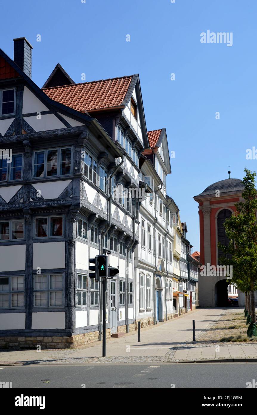 Germany, Niedersachsen, Wolfenbüttel:   a row of timber-frame houses facing the Holzmarkt (Wood Market) with part of the Trinitatis Church on the righ Stock Photo
