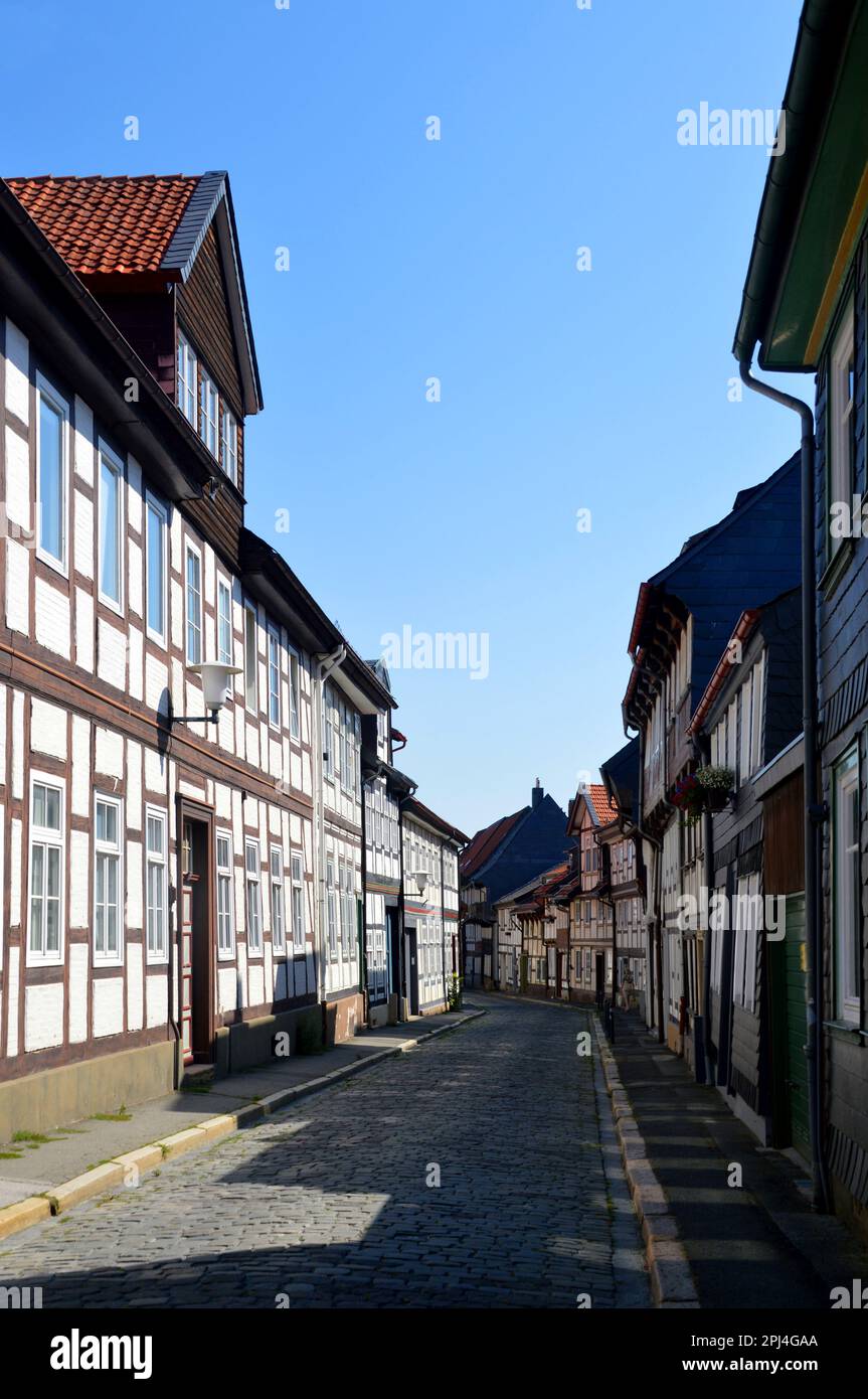 Germany, Lower Saxony, Goslar:  timber frame houses line both sides of this cobbled street. Stock Photo