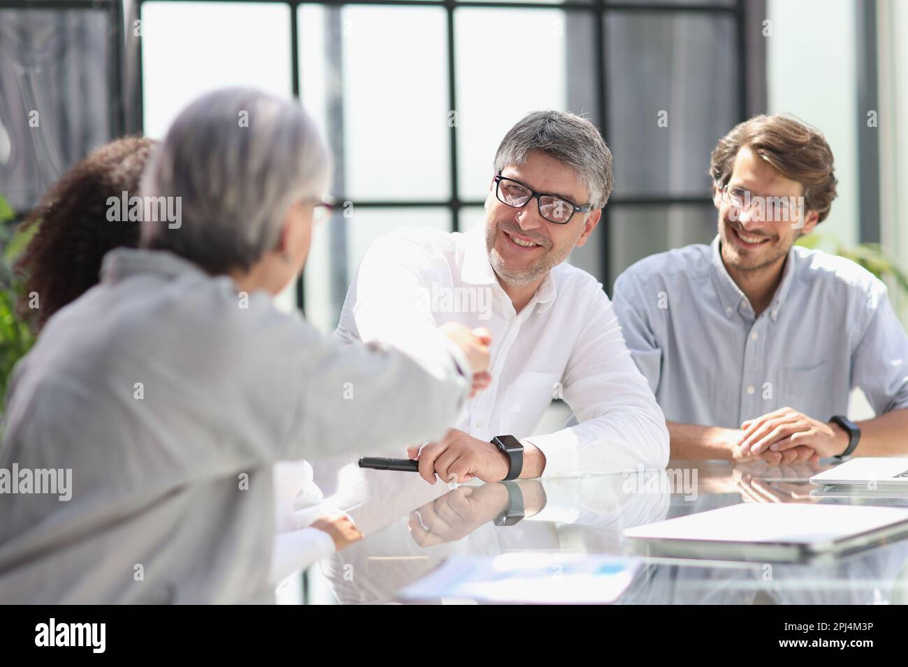 discussion of business people in the office sitting at the table Stock Photo