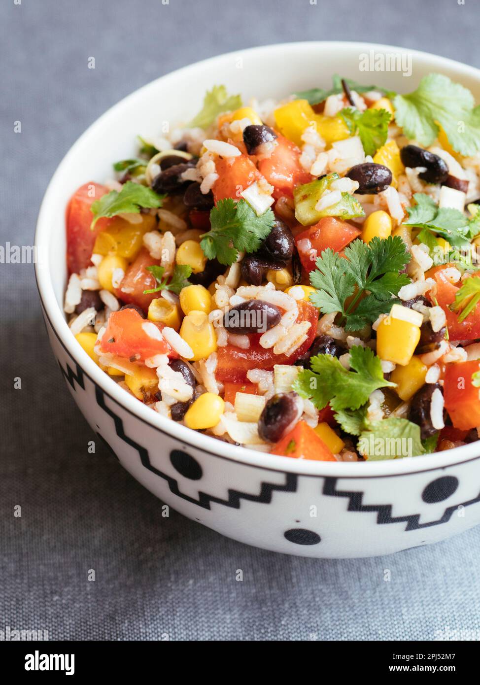 Bowl with a healthy multi-grain rice salad with beans, corn and bell ...