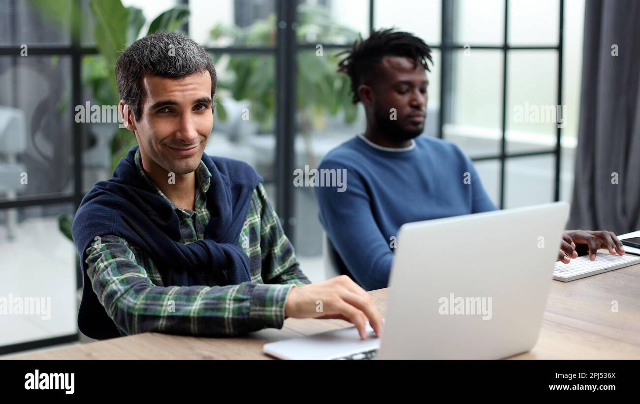 Young multiethnic businessmen working at the negotiating table Stock Photo