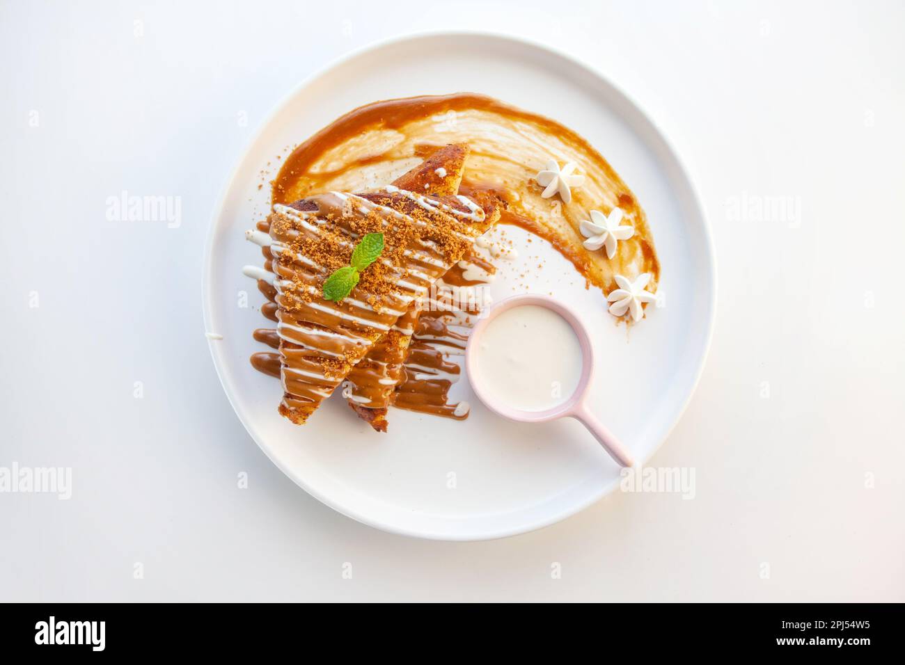French toast in lotus crunch biscuit flavour served on a white plate