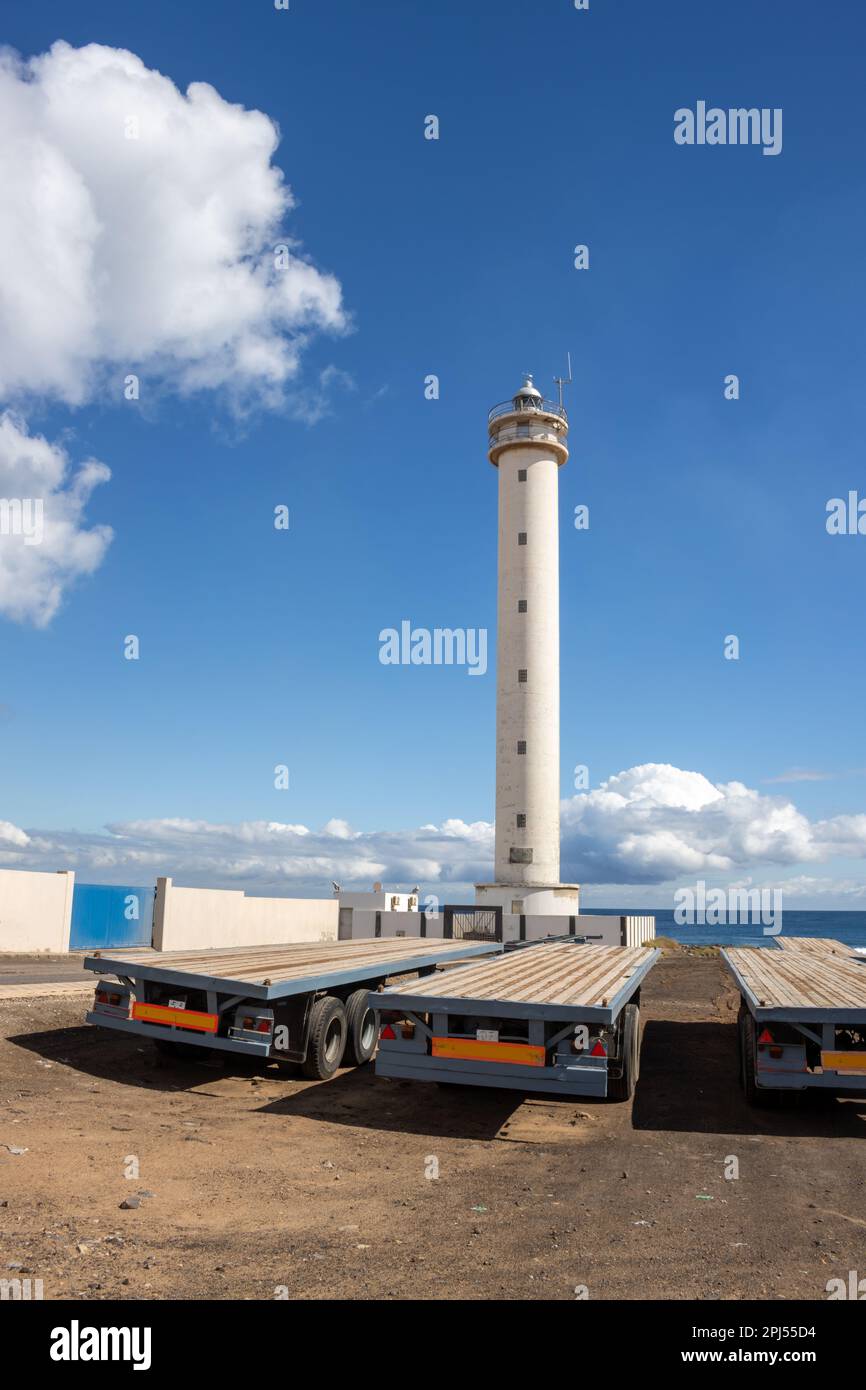 Lighthouse in an industrial zone of the capital city. Tall white