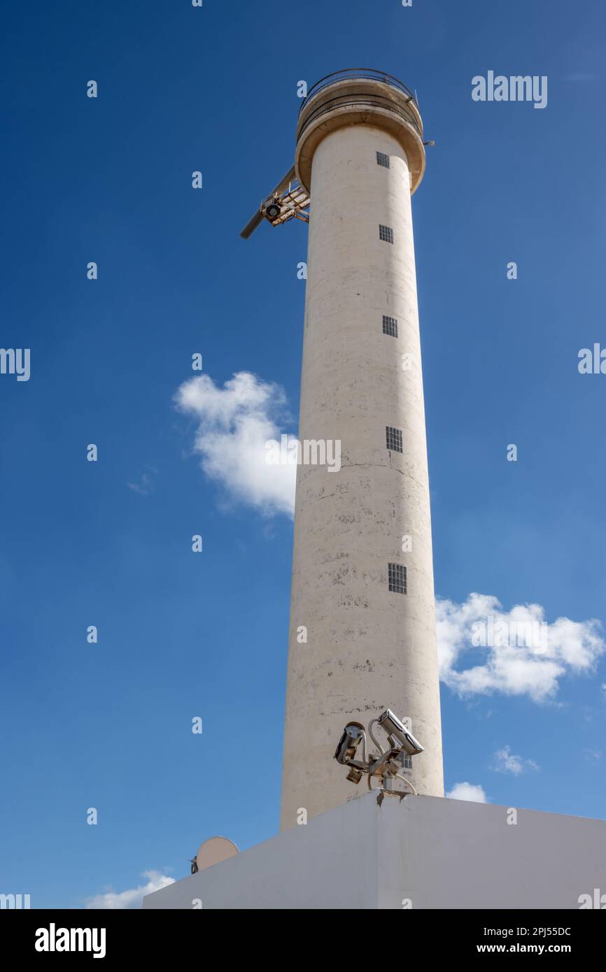 Lighthouse in an industrial zone of the capital city. Tall white