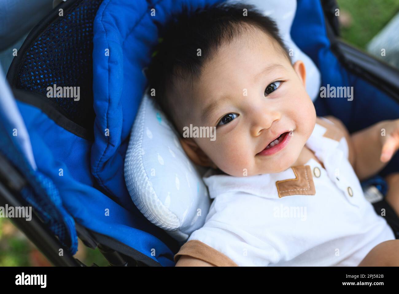 Portrait of cheerful son travel with family on holiday weekend Stock Photo