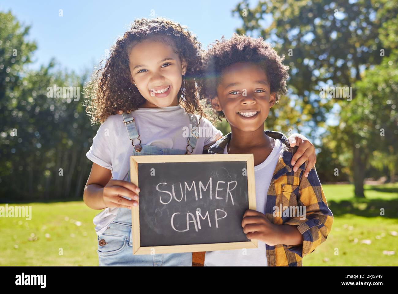 Summer camp sign, portrait or happy kids hug in park together for fun ...