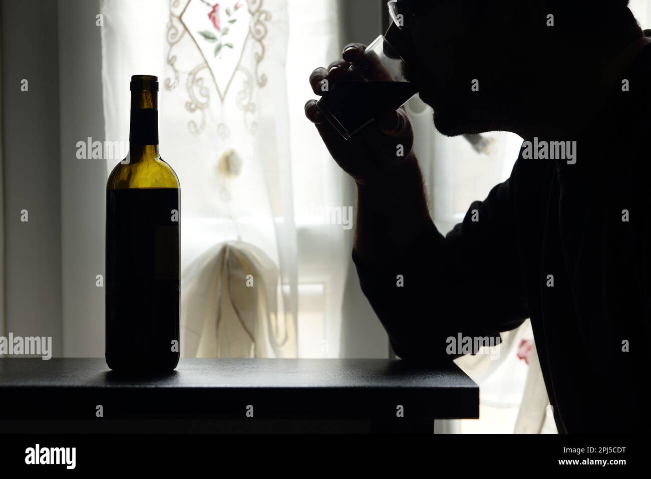 alcoholism - addiction - drunk - drinking wine Stock Photo