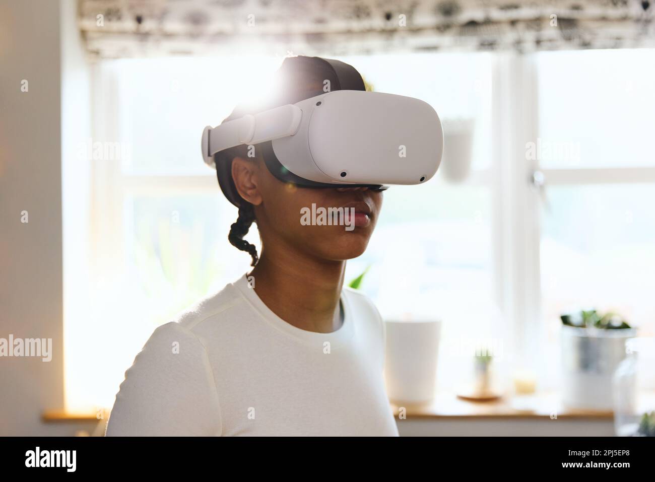 Teen girl wearing Virtual Reality headset Stock Photo - Alamy
