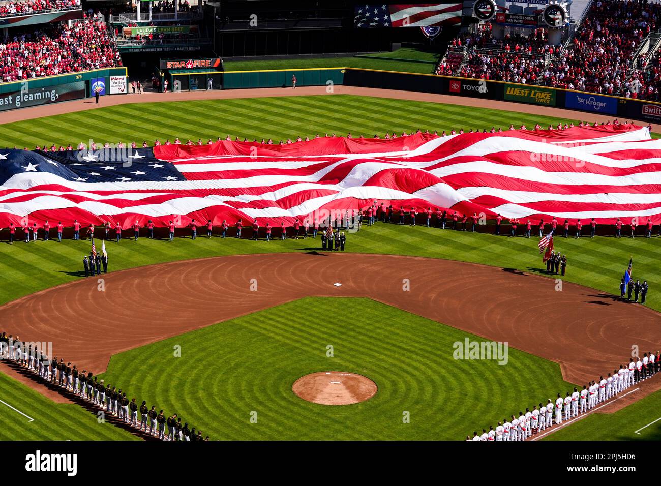 Fans attend an opening day baseball game in Cincinnati between the