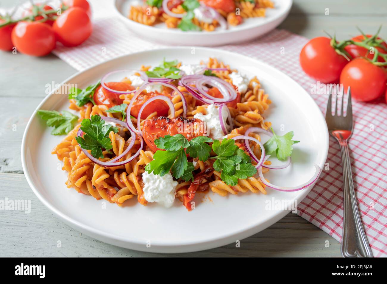 Fitness meal with whole grain pasta, vegetables and high protein cottage cheese on a plate Stock Photo
