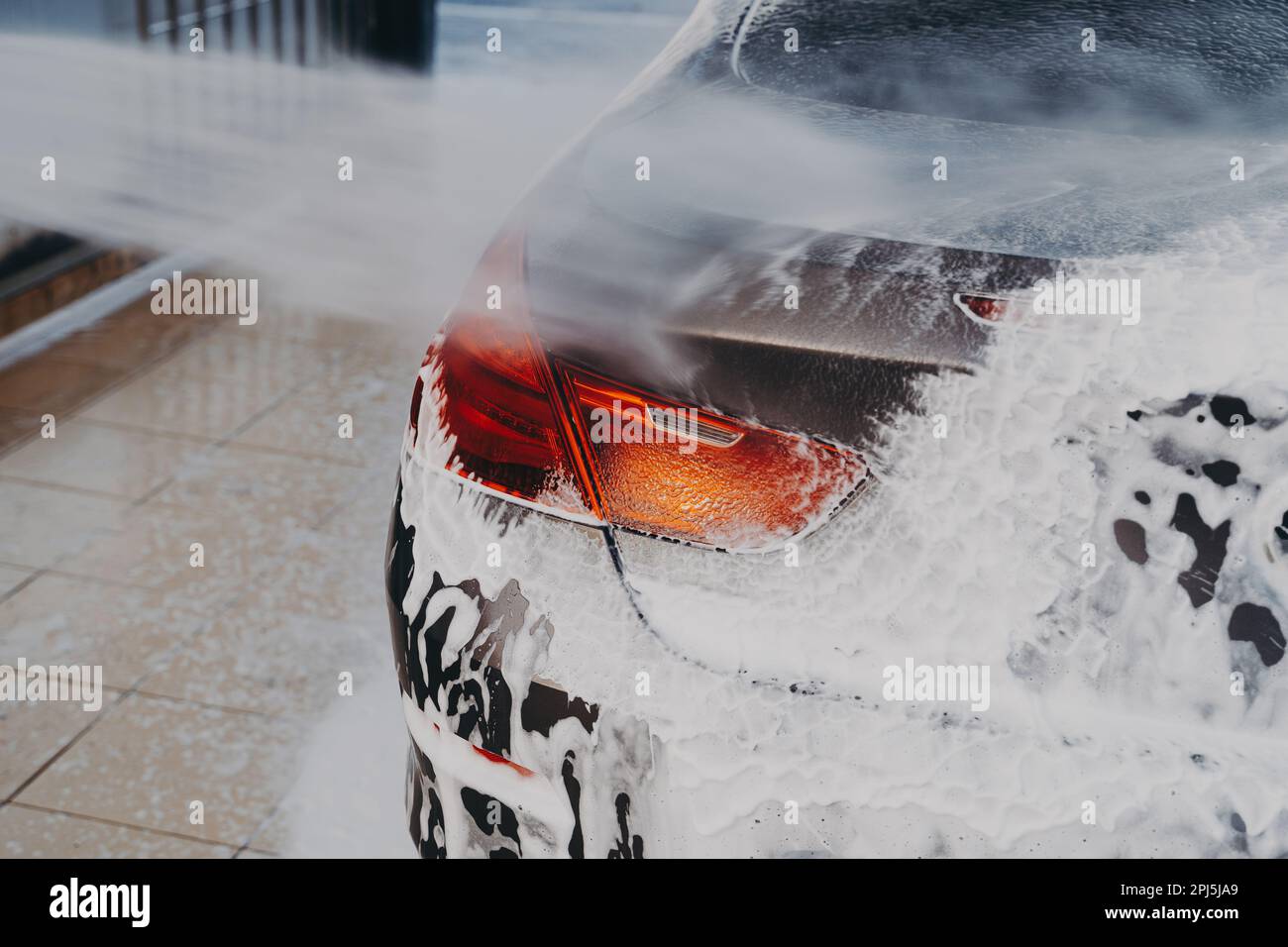 Process of removing dirt from car exterior surface with high pressure