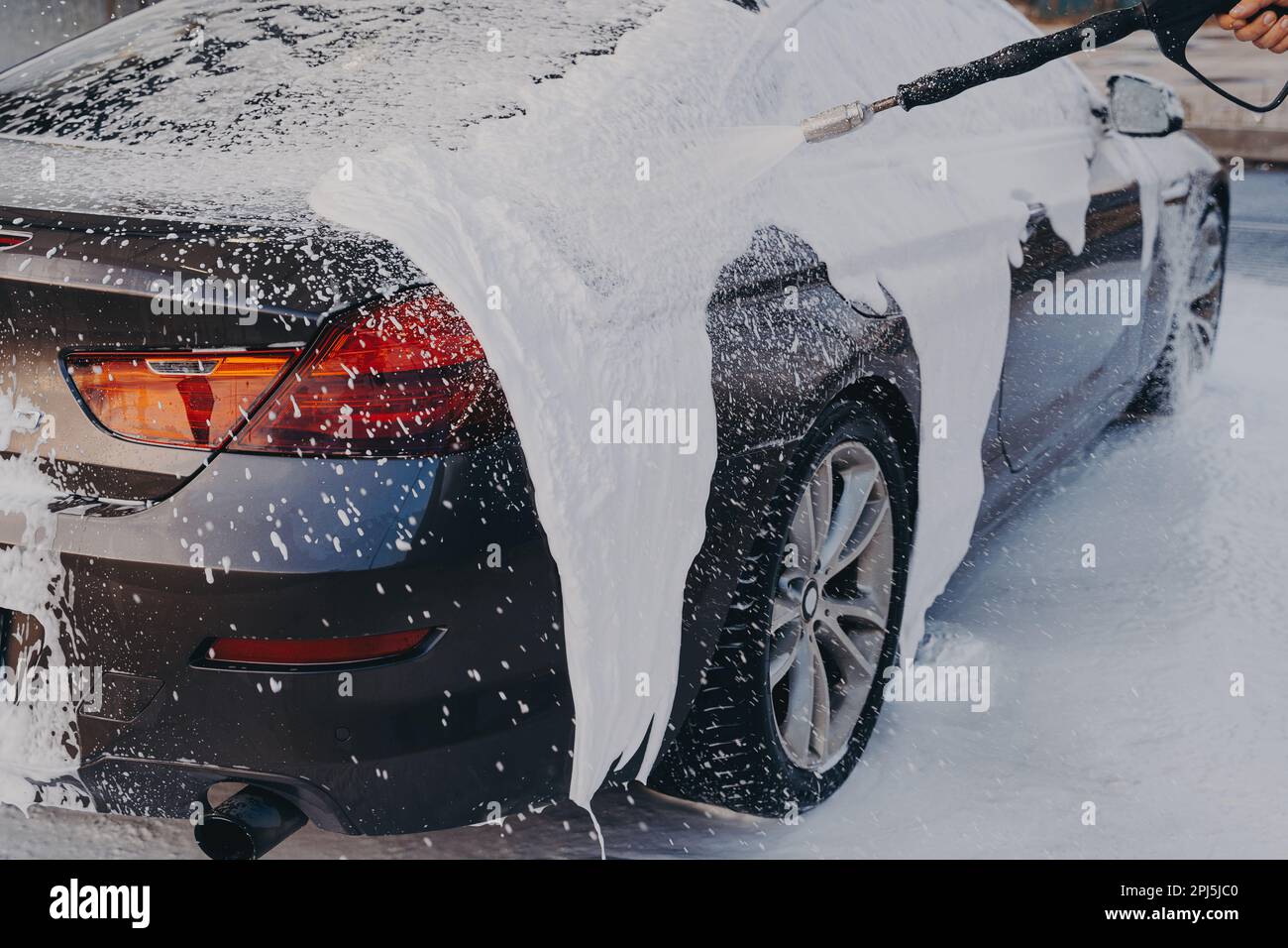 Professional auto cleaning. Exterior car wash with high pressure foam